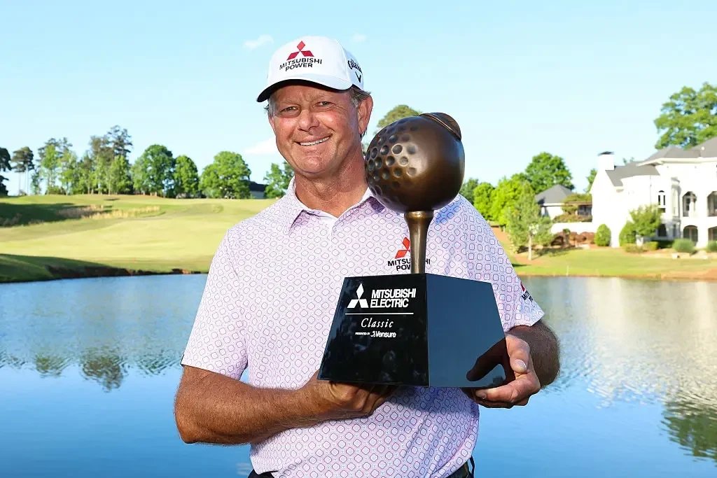 Retief Goosen holds the trophy after winning the 2026 Mitsubishi Electric Classic at TPC Sugarloaf